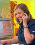 Nurse with computer on the phone