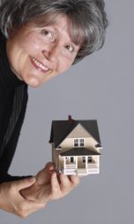 Woman with model house